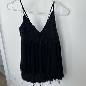 Black, flowy, open back tank. Lace detail on top. Lightly worn.